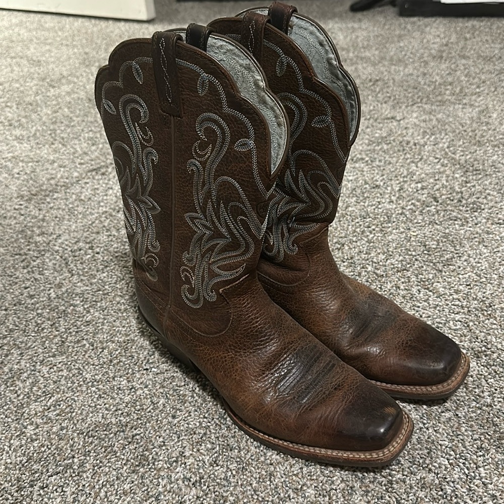 Brown ariat boots with blue stitching